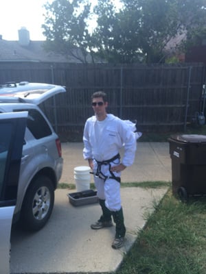 Certified pest control applicator in protective gear